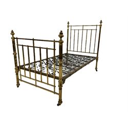 Victorian single brass bed with coil sprung mattress support, terminating in ceramic castors 