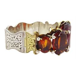 Victorian large silver graduating oval cut citrine bracelet, with articulated bright cut foliate link panels