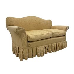 Late Victorian mahogany framed two seat humpback sofa, sprung back and seat upholstered in yellow foliate patterned damask fabric, on turned feet with castors
Provenance: From the Estate of the late Dowager Lady St Oswald