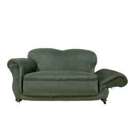 Early 20th century two seat drop arm sofa, upholstered in green fabric, raised on turned bun feet with plastic castors 