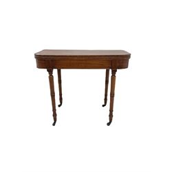 Early 19th century mahogany card table, fold-over top with baize lined interior, on turned supports with brass castors