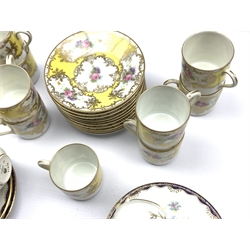  Nine Selb Bavarian coffee cans and ten saucers with floral sprays on a yellow and gilt ground  and six Wedgwood coffee coffee cups and saucers  