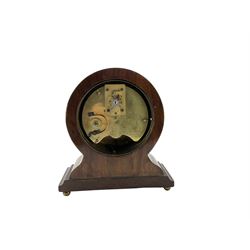 A late 19th  century French bedside table clock and a late 20th century English bedside strut clock.

