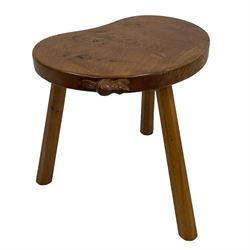 'Beaverman' oak three-legged stool, figured kidney shaped top carved with beaver signature, three tapered and splayed octagonal supports, by Colin Almack of Sutton-under-Whitestonecliffe