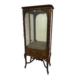 Late 19th/early 20th century French walnut and Kingwood vitrine or display cabinet, the projecting cornice decorated with applied foliate cast band, bevelled glazed door and sides, canted uprights with trailing ribbon band decorated with flowers, the door decorated with floral wreaths, oak leaf and acorn branches and cartouche mounts, cabriole supports joined by shaped and scrolled stretchers united by platform