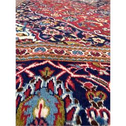 Persian Tabriz red ground rug, floral medallion on busy red field, enclosed by multi line border 303cm x 198cm