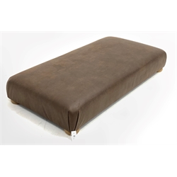 Large contemporary rectangular footstool, upholstered in brown leather, raised on compressed bun supports 