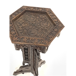 Early 20th century Indian carved table, profusely pierced and carved with flowers and foliage, D36cm, H76cm