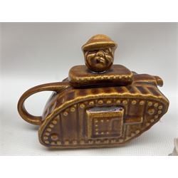 Pottery 'Churchill' WWI tank teapot in brown glaze, crested ware including Cenotaph, E boat, two sailors, Goss model of a bronze and other crested items etc (19)