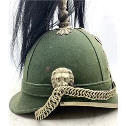 19th century German military helmet, possibly Jäger Infantry, green cloth scull with silver-plated starburst badge centred by a hunting horn and red, white and blue cockade, lion mask bosses, felt backed chin chain, silver-plated spike with black horsehair plume H34cm