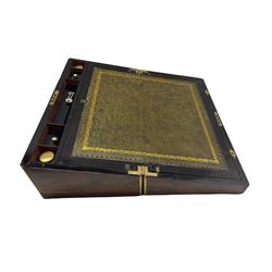 Victorian brass bound walnut writing slope, the hinged lid opening to reveal a tooled green leather writing surface, ebonised pen tray, fitted compartments and two glass inkwells, three secret drawers below, L50cm, D27cm, H19.5cm