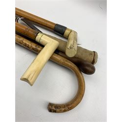 Two horn handled malacca walking sticks and various others