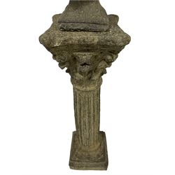 Cast stone garden female bust looking left, classical styled hair with laurel crown, on corinthian column pedestal with fluted decoration