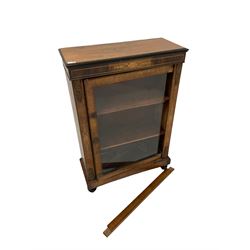 Victorian walnut pier cabinet with boxwood inlay, raised on ebonised turned supports 