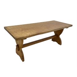'Gnomeman' oak coffee table, rectangular adzed top, on shaped end supports joined by plain stretcher, with Yorkshire Rose mounts to each end, carved with gnome signature, by Thomas Whittaker of Littlebeck