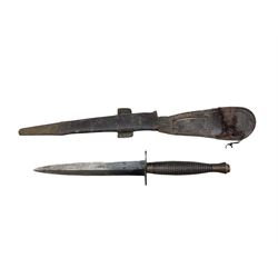 Commando knife by William Rodgers, Sheffield with double sided blade and ring grip, the leather scabbard marked with Ordnance arrow 