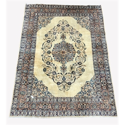 Persian Kashan ground rug, floral medallion enclosed by interlaced trailing foliate on ivory field, triple guarded border with stylised foliate decoration, 250cm x 350cm