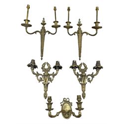 Pair of 20th century cast brass twin-branch wall sconces 28cm x 24cm, another pair with flited back plate and one other (5)