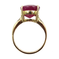 Gold single stone oval ruby ring, with diamond set shoulders stamped 18ct, ruby approx 7.00 carat
