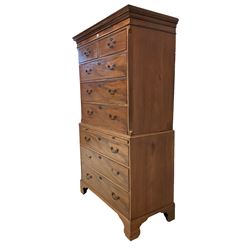 George III mahogany chest-on-chest, dentilled cornice over two sort and three long drawers flanked by reeded canted edges, the lower section fitted with brushing slide over three drawers, raised on bracket feet