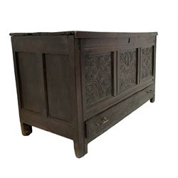 18th century oak coffer or mule chest, rectangular hinged top concealing compartment and candle box, the three front panels carved with stylised acanthus leaves and foliate decoration, the base fitted with single drawer with carved decoration, raised on stile feet