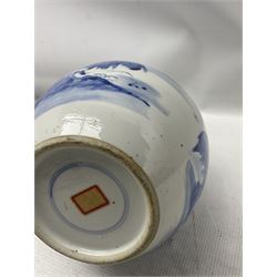 Chinese Qing dynasty blue and white bottle vase painted with a continuous landscape scene depicting boats on a river, a farmer with a tethered buffalo and pavilions and mountains, double ring mark and collector's paper label beneath, H30cm