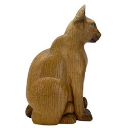 Mouseman - carved oak figure of a seated Siamese cat, with light blue coloured eyes, carved with mouse signature between legs, by the workshop of Robert Thompson, Kilburn 