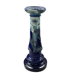 Art Nouveau Burmantofts Faience jardiniere and stand circa 1900, modelled in relief with pale blue flowers and foliage on a turquoise and dark blue ground, inscribed and impressed marks, model no.2263, H104cm x D32cm
