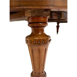 Victorian mahogany extending dining table, the extendable wind-out top with three additional leaves, raised on turned and fluted supports, terminating in ceramic castors 