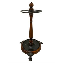 Theodore Alexander - Victorian design mahogany umbrella or stick stand, turned pedestal with four division stick restraint, circular base with inset dished drip tray, on three acanthus leaf decorated claw feet
Provenance: From the Estate of the late Dowager Lady St Oswald