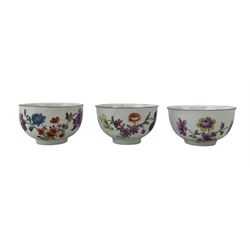 Set of seven 18th century Meissen tea bowls with four saucers, each hand painted with botanical studies within chocolate rims, blue crossed swords marks beneath, saucer D8cm (11) Provenance: From the Estate of the late Dowager Lady St Oswald