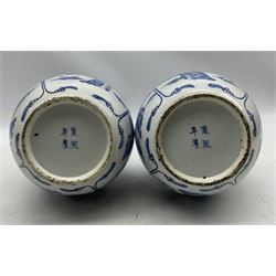 Pair of Chinese Qing dynasty blue and white bottle vases, the globular body decorated with 'Long Eliza and the Playing Boys' in four panels and pointed leaf tips to the necks, bearing Kangxi Nian Zhi character mark beneath, H36cm 