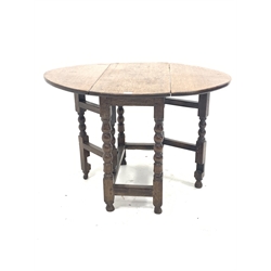 18th century oak gateleg table, the oval top with two drop leaves, over bobbin and block turned supports 