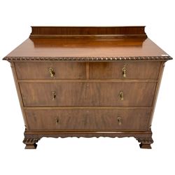 Mid-20th century mahogany linen chest, raised back over rectangular top with gardroon carved edge, two short drawer over two long drawers, the upper long drawer with fall front, canted upright corners, on ogee bracket feet carved with gadroons and c-scrolls
