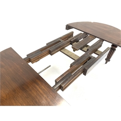 Late Victorian mahogany extending dining table, with 'D' shaped moulded ends and three additional leaves, raised on turned and reeded supports terminating in brass cup castors