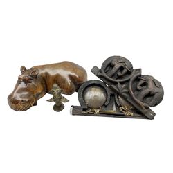 Set of 19th/ early 20th century opium scales in a carved hardwood case depicting an elephants, carved model of a Hippo, together with Benin type bronze model of a Bird (3)