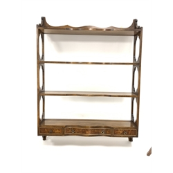 20th century mahogany wall hanging three tier rack, with peirced panel ends, serpentine front and three trinket drawers, (W69cm) together with a Reprodux mahogany two tier occasional table with turned and square splayed supports (H70cm)