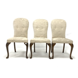 Set of three early 20th century Queen Anne style stained beech chairs, upholstered in white damask fabric, raised on shell carved cabriole front supports 