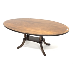 20th century mahogany coffee table, oval cross banded top, four pillar on platform with reeded out splayed supports, 120cm x 68cm, H48cm