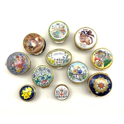 Collection of Worcestershire and Staffordshire enamel boxes to include a painted still life of fruit signed S. Smith,  1996 & 1997 year box and others, together with four Royal Worcester porcelain pill boxes, three from the Connoisseur collection and a Millennium pill box (11)