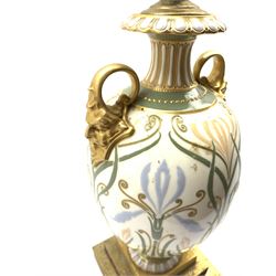 Late 19th/early 20th Century two handled baluster vase painted with flowers and foliage and with gilt mask handles, mounted on a stepped square base and fitted as a table lamp H30cm excluding fitting