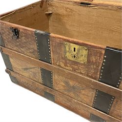 Victorian leather bound travelling trunk, hinged dome top, the outside decorated with etched geometric designs and wrought iron strapping with studwork borders