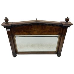 19th century mahogany wall mirror, the sloped arched top with two turned finials over blank frieze and bevelled edge mirror