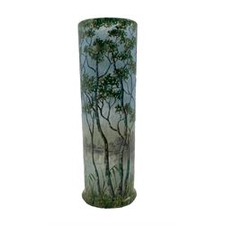 Daum Summer Landscape cylindrical glass vase circa 1900,  the mottled, overlaid and acid-etched body finely enamelled with a continuous lake scene with birch trees and grasses in the foreground, signed Daum Nancy and with the Cross of Lorraine to the underside, H16.5cm x D5cm 