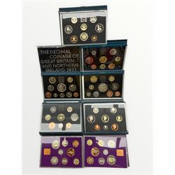 Royal Mint United Kingdom proof coin collections dated 1986, two 1994, 1996, 1997 all housed in blue folders with certificates, 1995 in blue folder without certificate, two 1970 and one 1971, in plastic cases with card sleeves (9)