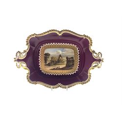 Mid 19th century Rose & Co. Coalport twin-handled dish hand painted with a view of Wenlock Abbey, Shropshire surrounded by a raised gilt border on a maroon ground, L32.5cm 