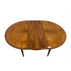 G-Plan - mid-20th century teak 'Fresco' dining table, oval top over concealed integrated double leaf, on cylindrical tapering supports