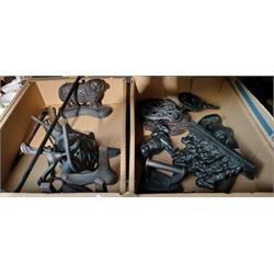 Quantity of cast iron including cobblers lasts, doorstops trivet, fire irons etc in two boxes 