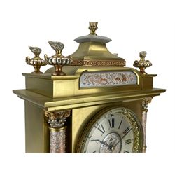 French - late 19th century 8-day brass cased mantle clock, with a tiered pediment surmounted by a central finial with mounted flambé finials to the corners, silvered two-part dial with Roman numerals, steel hands and a cast bezel flanked by two circular columns with Corinthian capitals, with contrasting applied filigree decoration to the pediment, pillars and front of the case, rectangular stepped plinth with a decorative base on block feet, Japy Freres twin train Parisian movement with square movement plates and rack striking, sounding the hours and half-hours on a coiled gong. With pendulum.