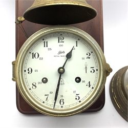  19th century brass anniversary clock with white enamel dial and Arabic chapter ring, under dome (H28cm) together with a 20th century brass cased bulkhead type wall clock, the white dial inscribed 'Shaltz, Royal Mariner' mounted on a walnut panel under bell, (H36cm)  